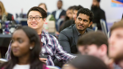 Diverse male students sitting in class